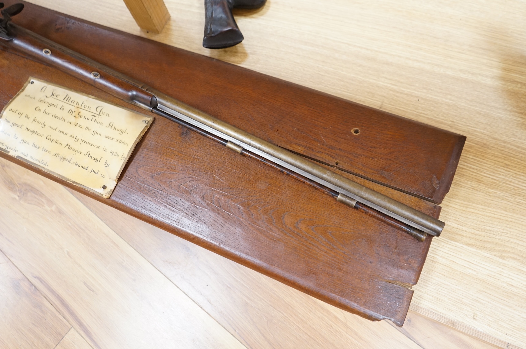 A single barrel flintlock sporting gun by Manton, half stocked, with signed lock and rainproof pan, platinum lined vent, and iron furniture (worn smooth)